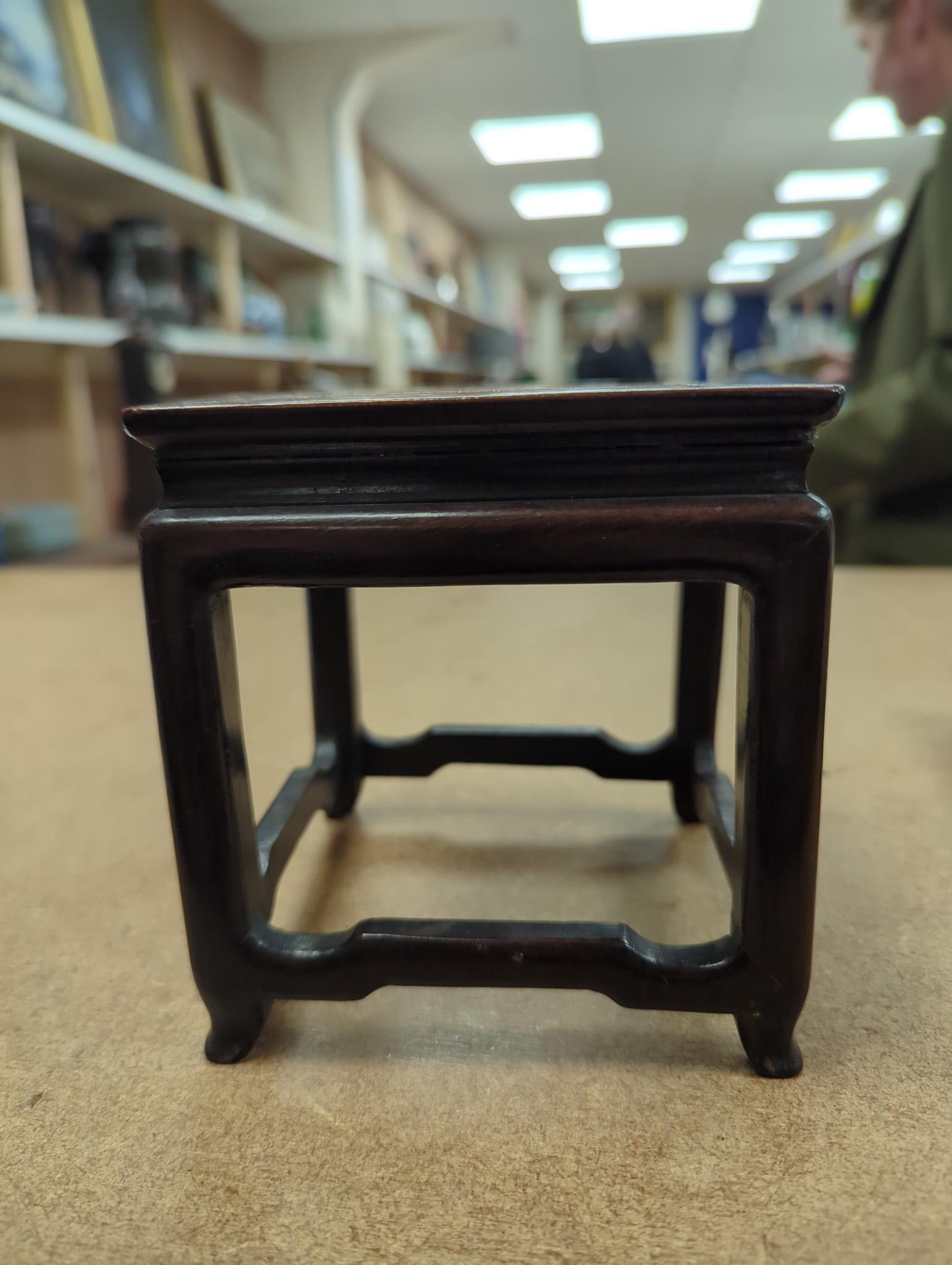 Two Chinese hardwood stands, one inset with marble, 13cms high